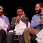 PA Student clap while they hold their white coats