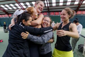 Brenau players hug after winning the final round of the Appalachian Athletic Conference women's tennis championships on Sunday