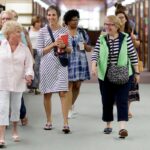 women walking in library