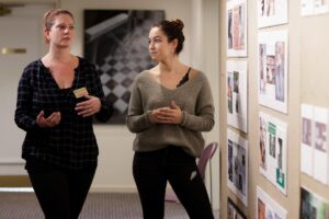 Studio Art Program Director Claudia Wilburn talks to interior design student Carmen Garcia-Pitarch Lopez. Both programs are part of the Center for the Arts & Design at Brenau University.