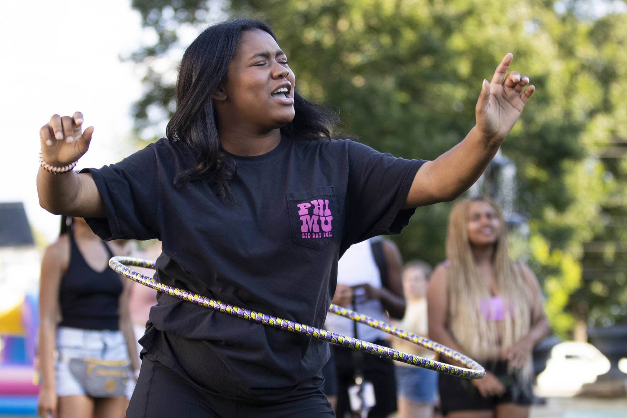 Student hula hooping at the back to school bash