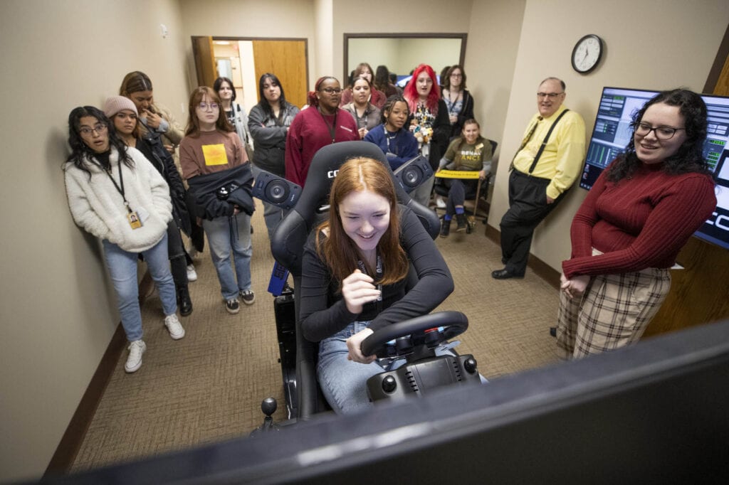 Strudent tries the driving simulator