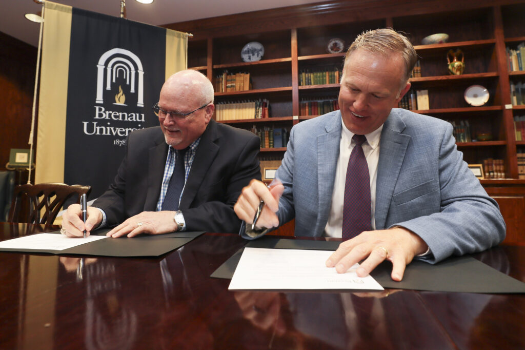 Barnett and Simpson sign the agreement