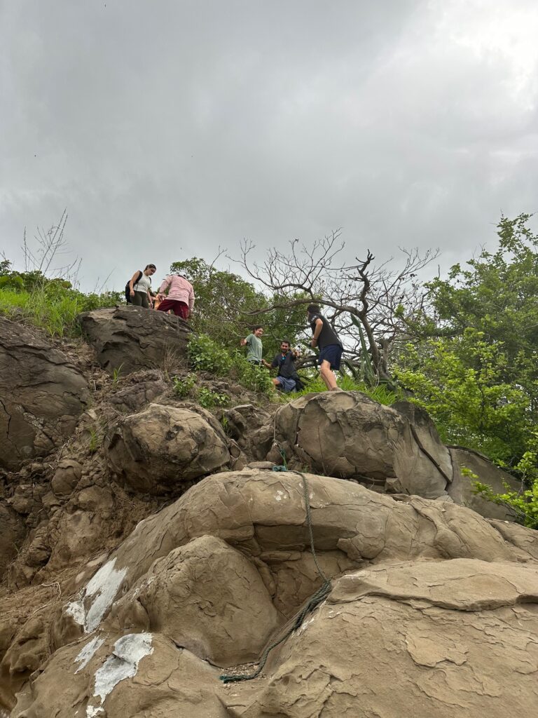 A cliff in Costa Rica with Brenau students climbing it