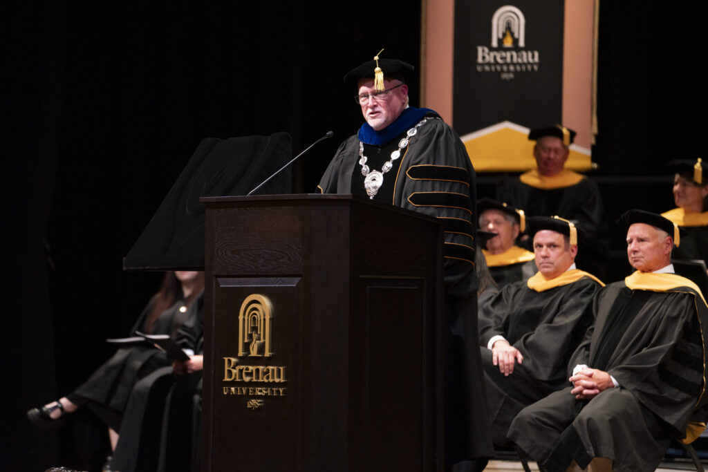 David L. Barnett speaks at the podium after receiving the medallion.