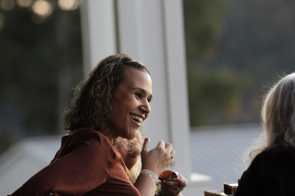 An alum smiles during a conversation