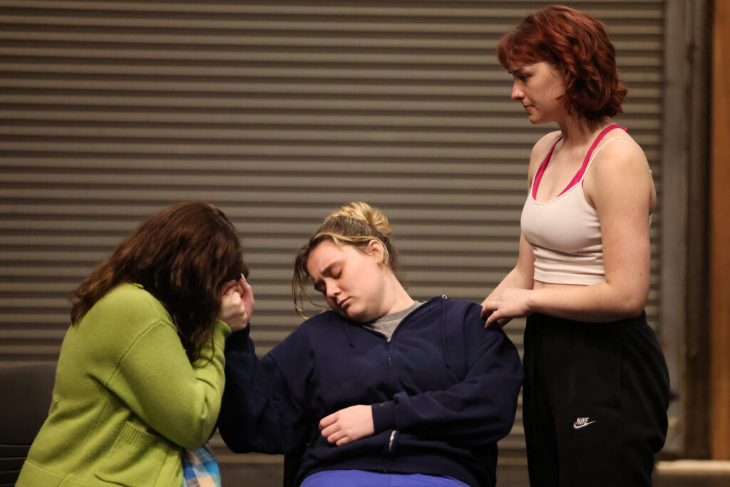 Three female actors rehearse, midscene.