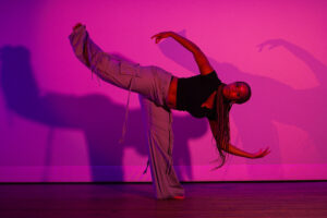 a dance student poses on stage